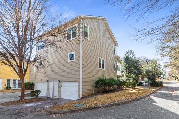 1731 Pryor Road Southwest, Unit 301 Atlanta, GA 30315 - Photo 24 of 29 a front view of a house with a yard