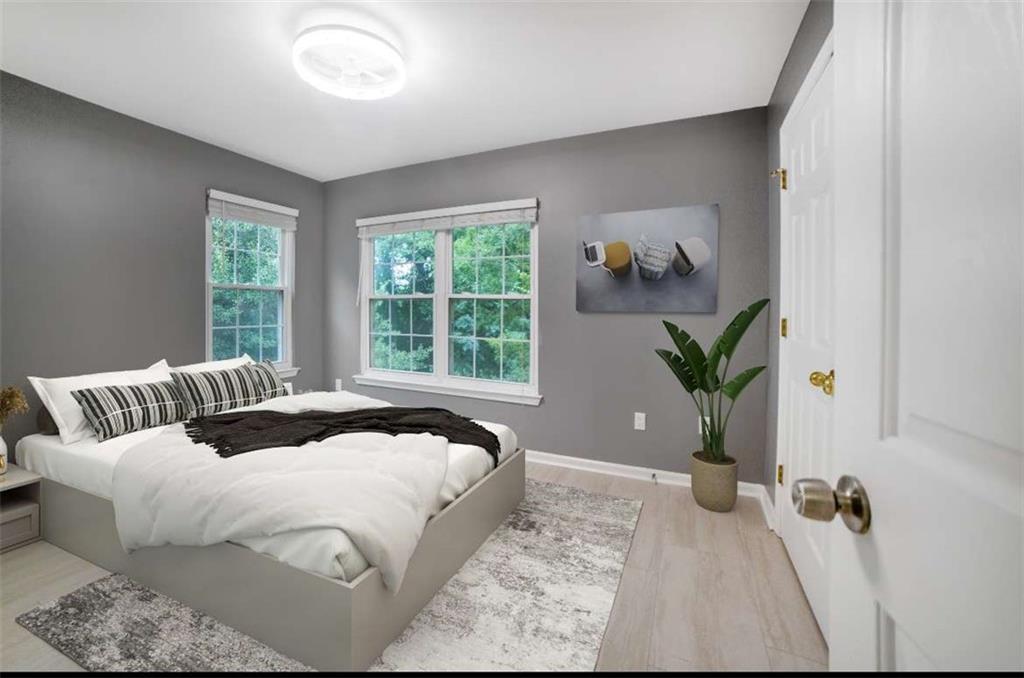 1731 Pryor Road Southwest, Unit 301 Atlanta, GA 30315 - Photo 5 of 29 a bedroom with a bed and window