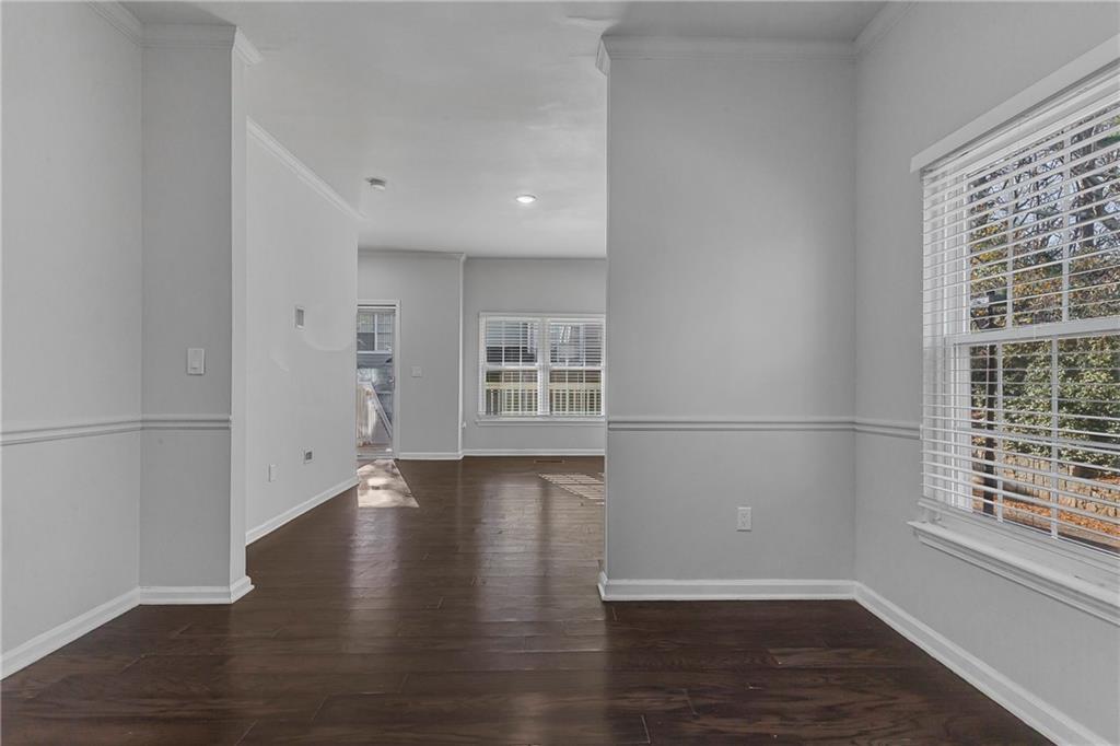 1731 Pryor Road Southwest, Unit 301 Atlanta, GA 30315 - Photo 9 of 29 a view of a kitchen with wooden floor and a window