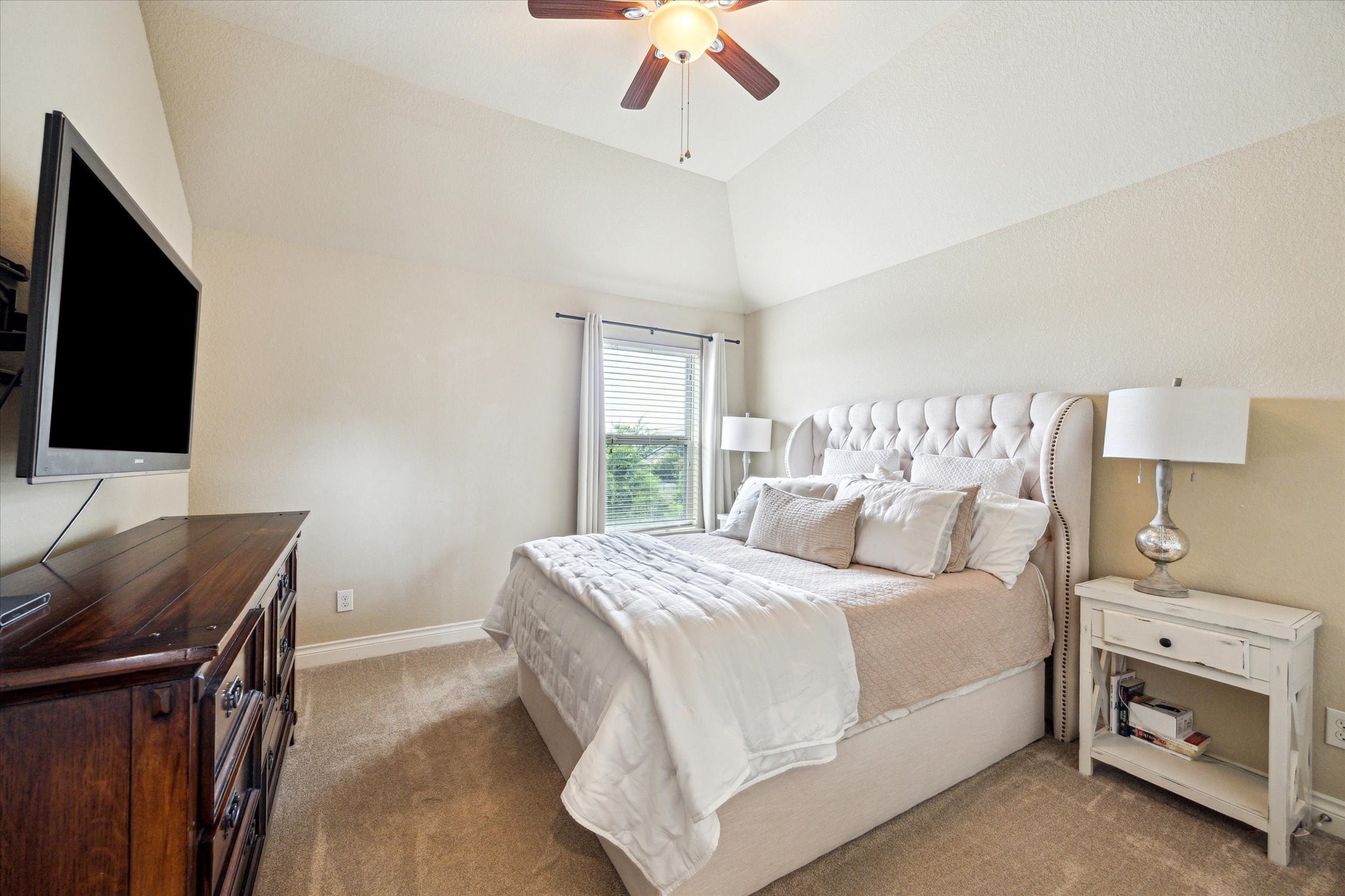 28919 Crested Butte Drive Katy, TX 77494 - Photo 29 of 36 Third bedroom features a
window, plush carpet, and ceiling fan.