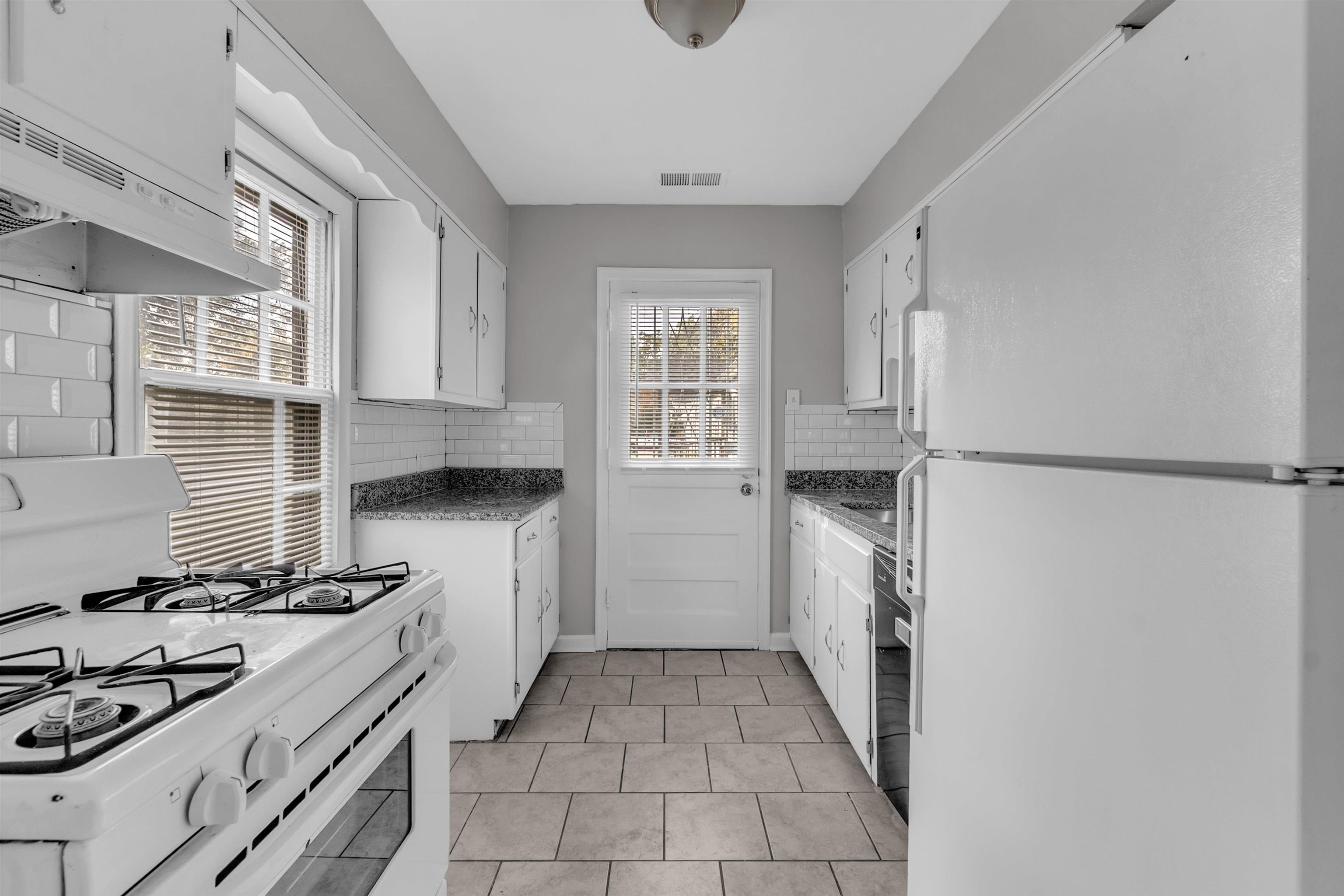 3844 Wilshire Road Memphis, TN 38111 - Photo 17 of 18 a kitchen with a sink stove and refrigerator