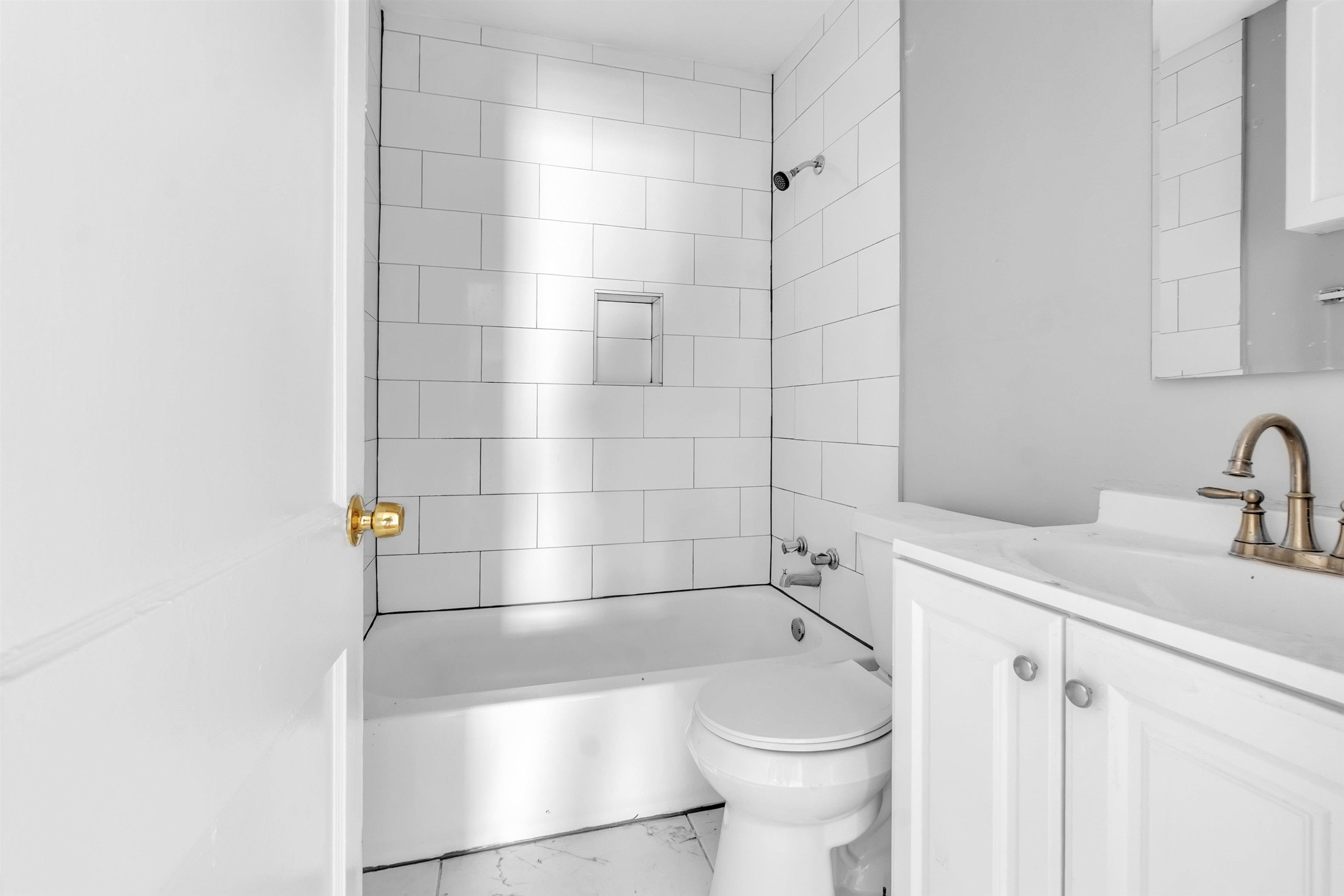 3844 Wilshire Road Memphis, TN 38111 - Photo 18 of 18 a bathroom with a sink a toilet and shower