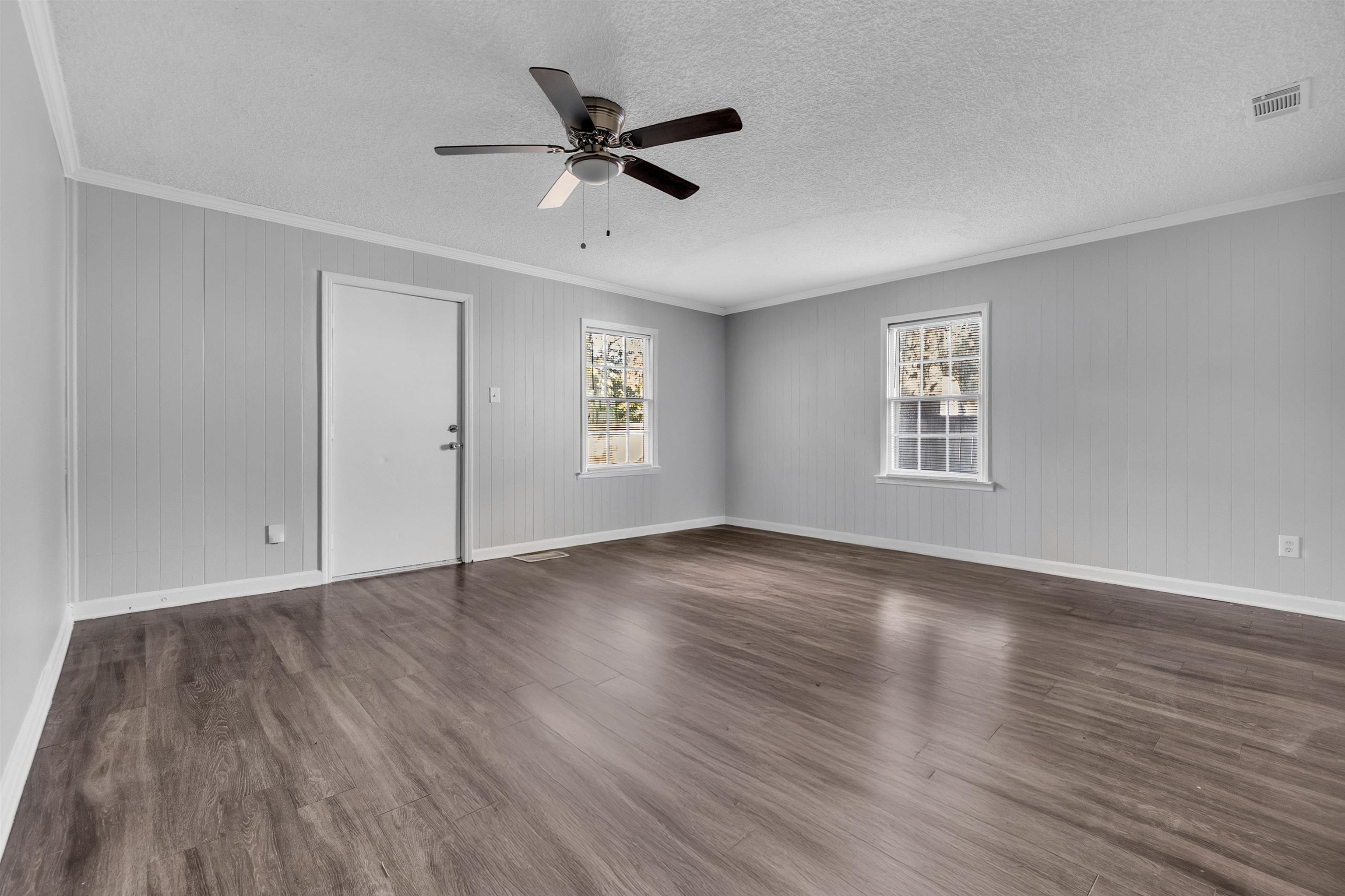 3844 Wilshire Road Memphis, TN 38111 - Photo 7 of 18 wooden floor in an empty room with a window