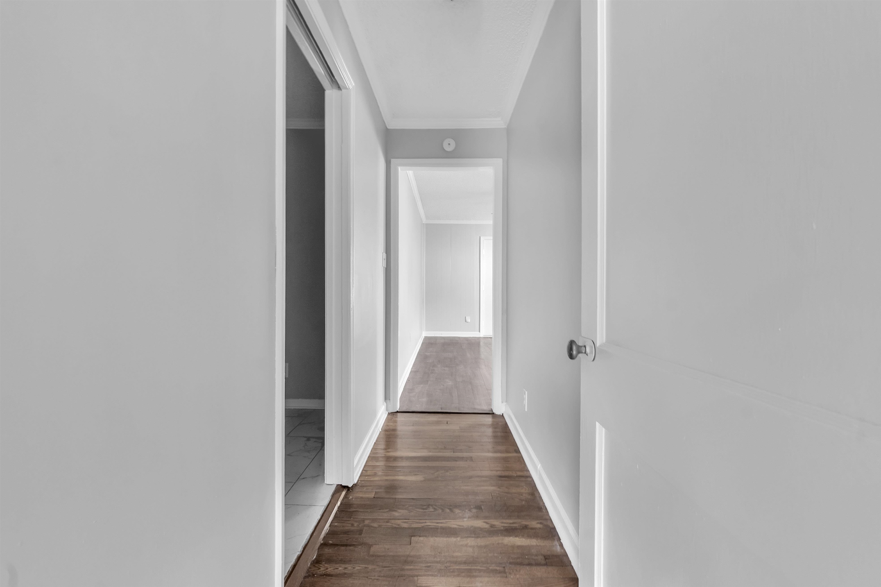 3844 Wilshire Road Memphis, TN 38111 - Photo 9 of 18 a view of a hallway with wooden floor
