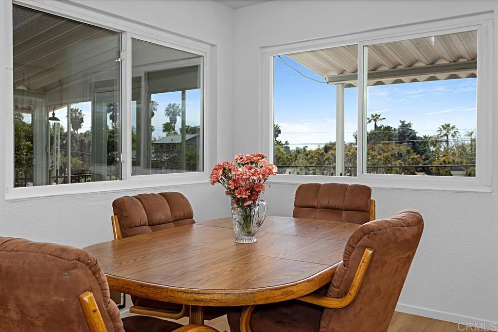1551 Burgundy Road Encinitas, CA 92024 - Photo 12 of 31 a view of a dining room with furniture window and outside view