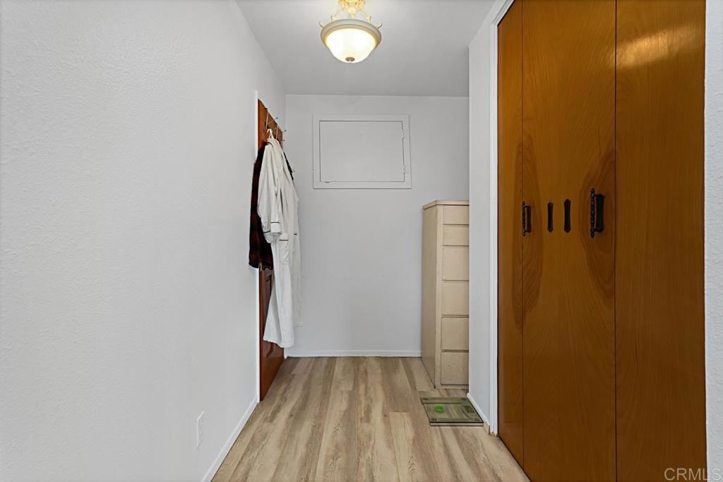 1551 Burgundy Road Encinitas, CA 92024 - Photo 25 of 31 a view of empty room with wooden floor and door