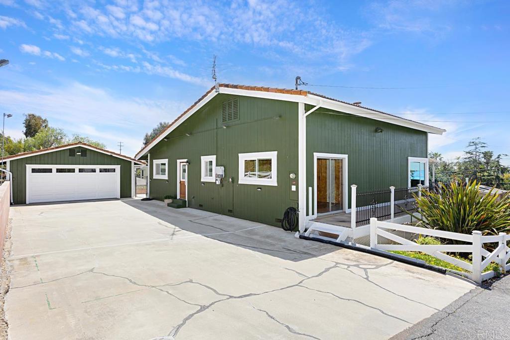 1551 Burgundy Road Encinitas, CA 92024 - Photo 27 of 31 a front view of a house with garden