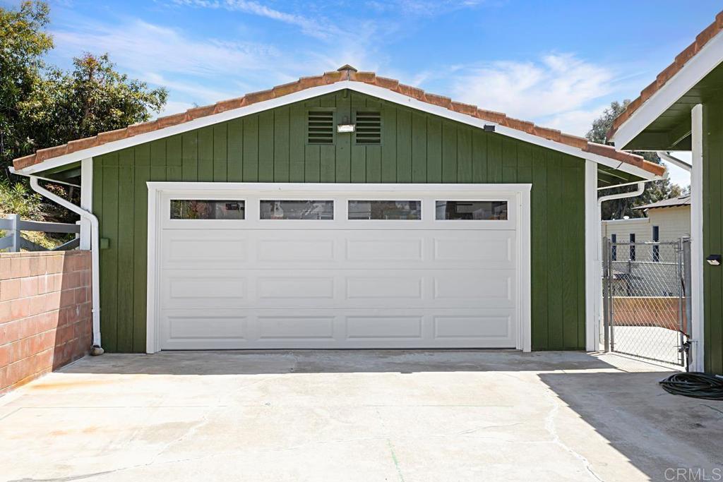 1551 Burgundy Road Encinitas, CA 92024 - Photo 28 of 31 a front view of a house with a garage