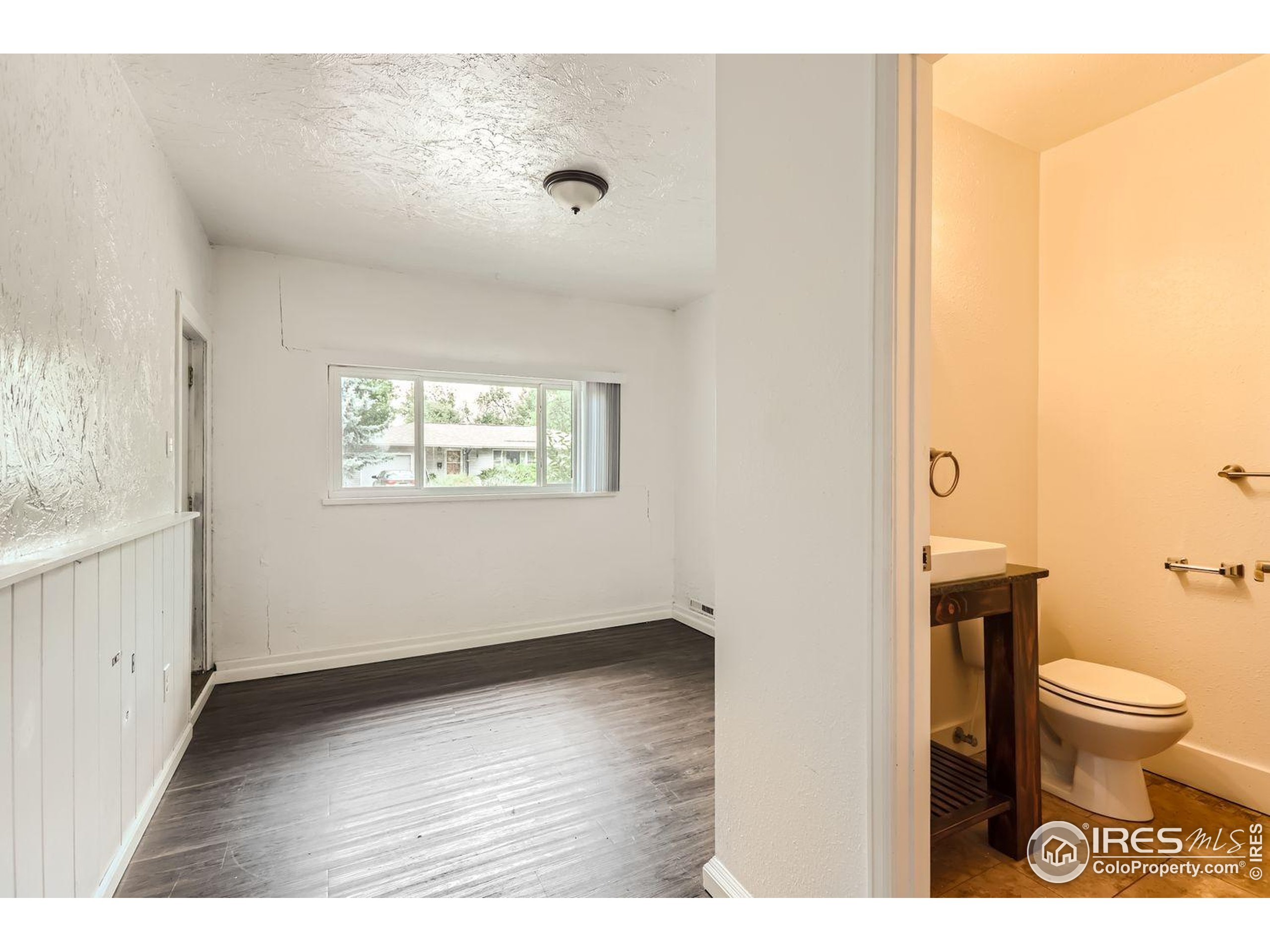 1517 Crestmore Place Fort Collins, CO 80521 - Photo 14 of 28 a bathroom with a toilet and a sink