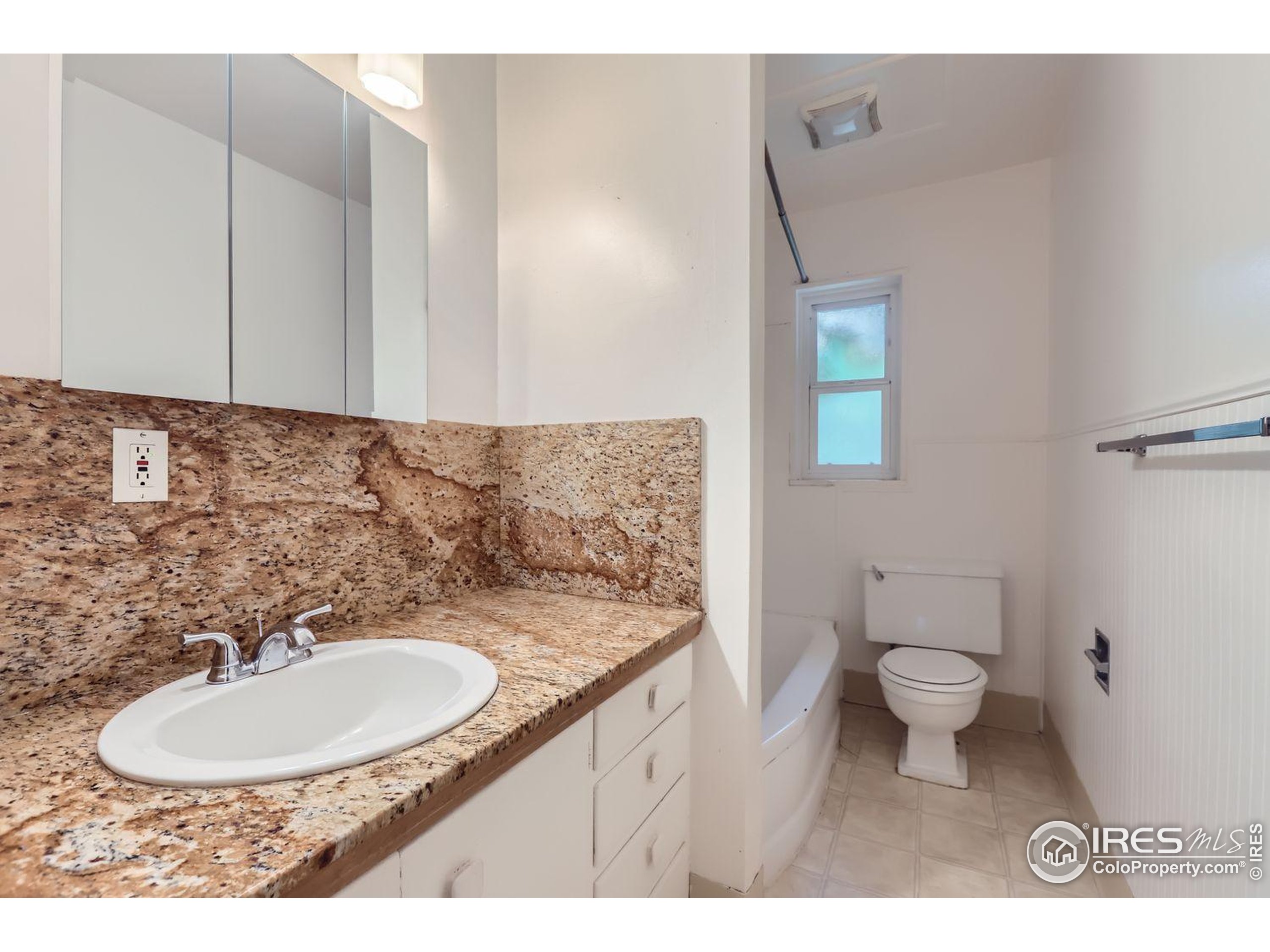 1517 Crestmore Place Fort Collins, CO 80521 - Photo 21 of 28 a bathroom with a sink and a mirror