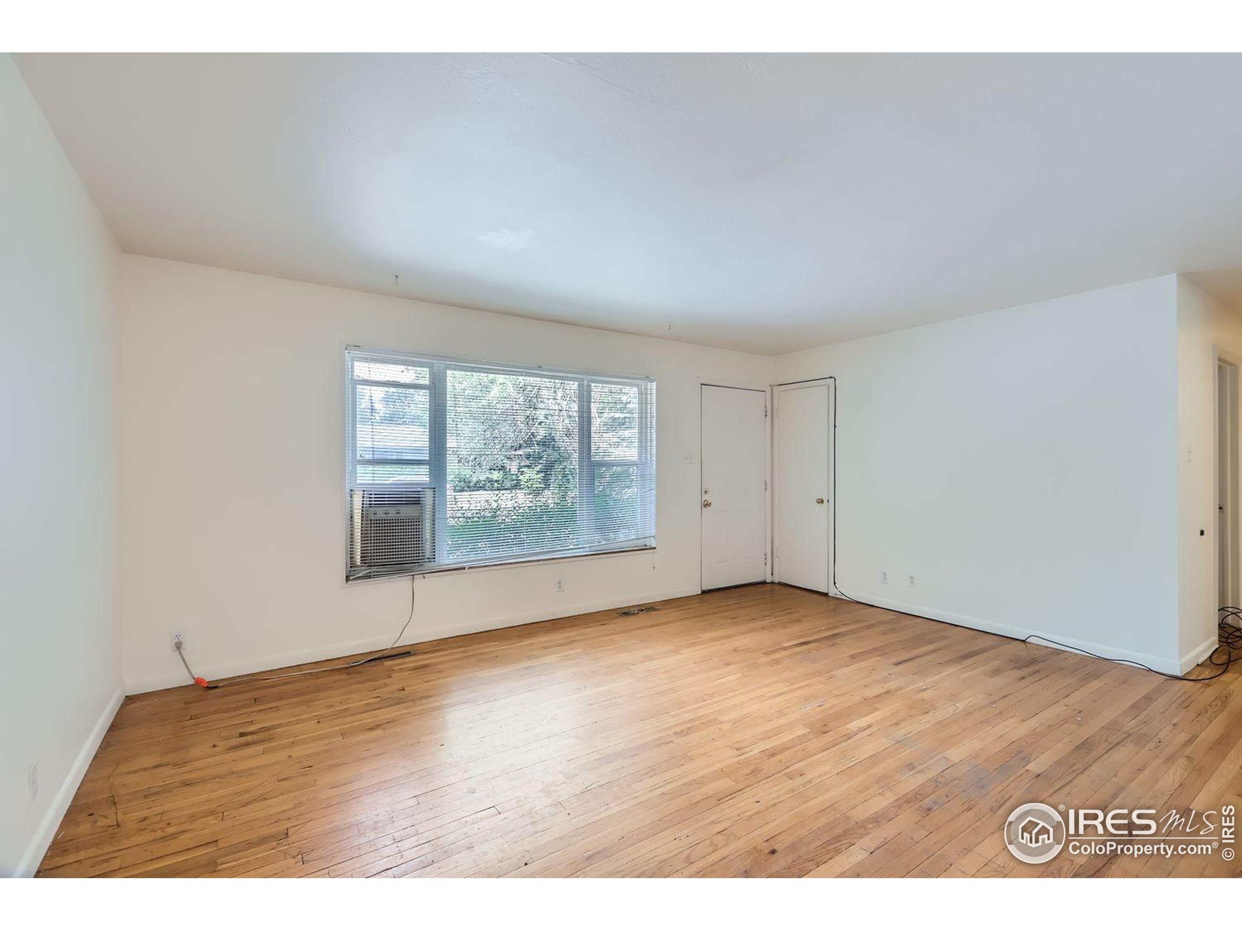 1517 Crestmore Place Fort Collins, CO 80521 - Photo 6 of 28 a view of an empty room with a window