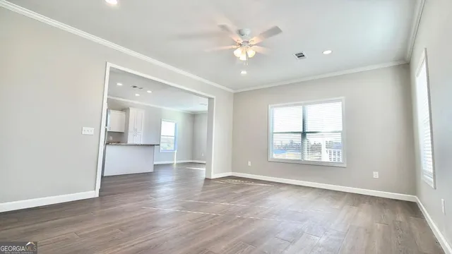 a kitchen with granite countertop a sink and cabinets