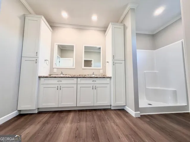 a bathroom with a glass door shower
