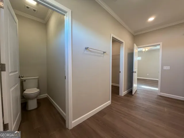 a view of a room with racks on the wall