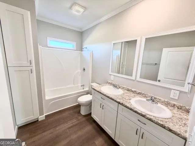a bathroom with a sink a toilet and a bathtub
