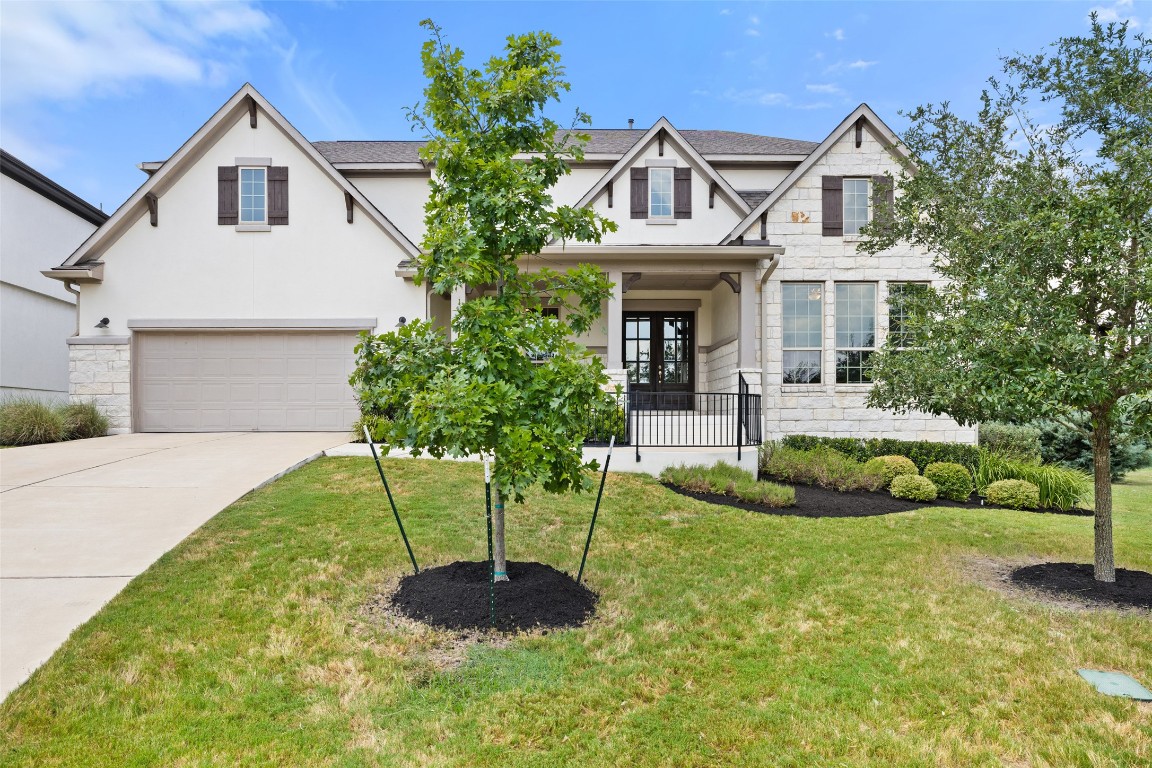 207 Patience Cove Austin, TX 78737 - Photo 1 of 1 a front view of a house with a yard