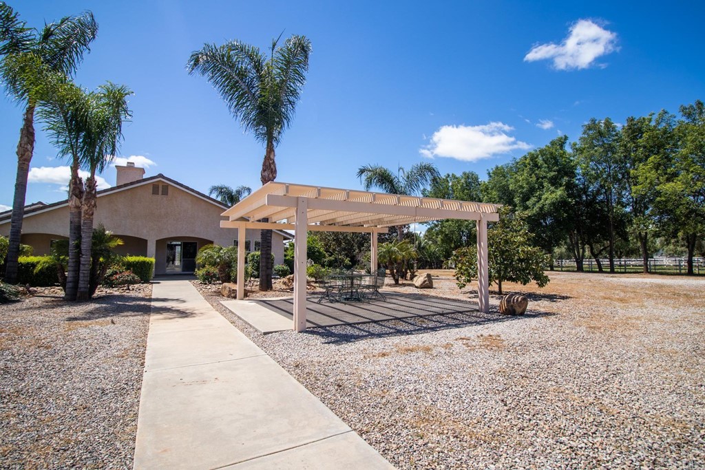 575-577 Rancho Trail Ramona, CA 92065 - Photo 37 of 47 a view of a street with a house