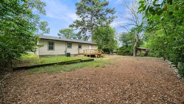 a house view with a backyard space