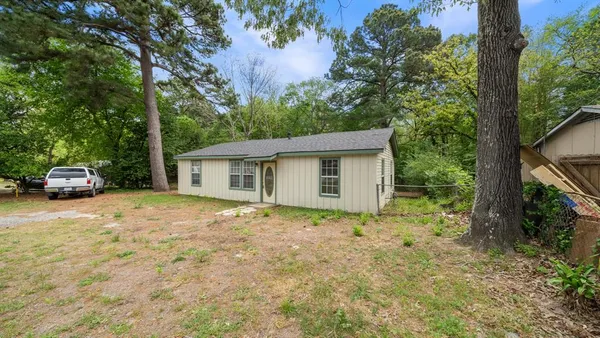 a house with trees in front of it