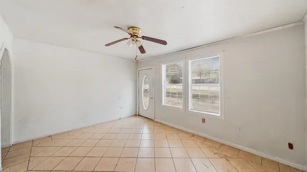 a view of an empty room with a window
