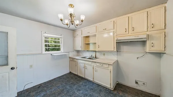 a view of a kitchen with marble kitchen and sink