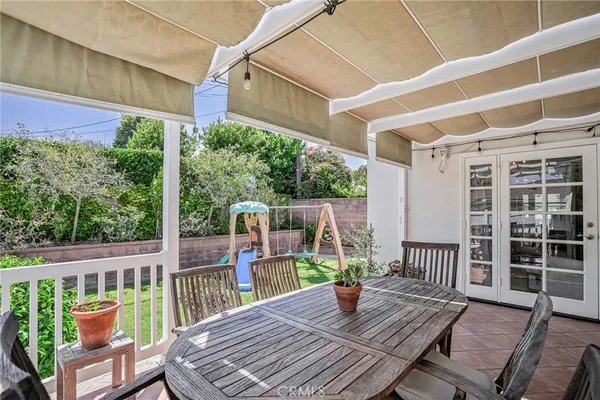 a view of balcony with wooden floor and outdoor seating