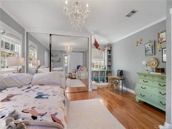 a bedroom with a bed and ceiling fan