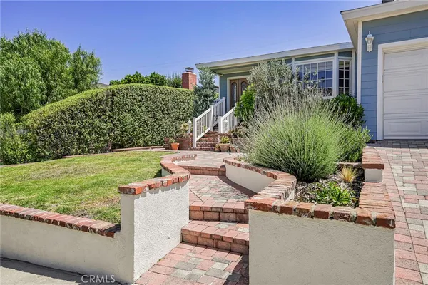 a view of a house with a garden