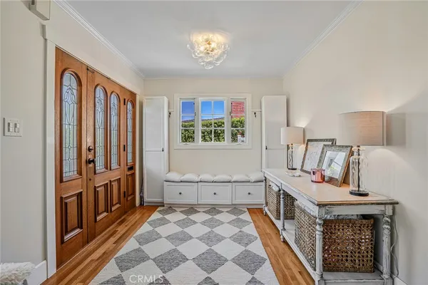a hallway with furniture and baby crib