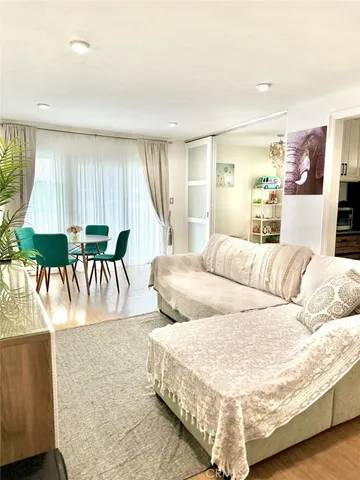 a large white bed in a white room