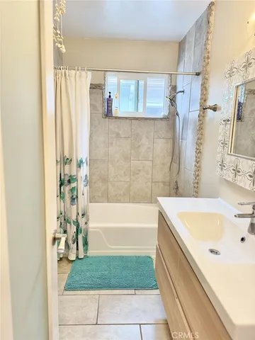 a bathroom with a bathtub and a sink