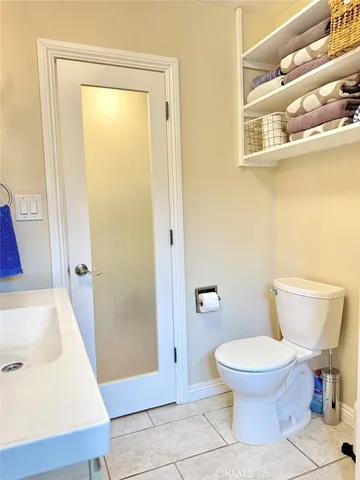 a view of a hallway with furniture and a window