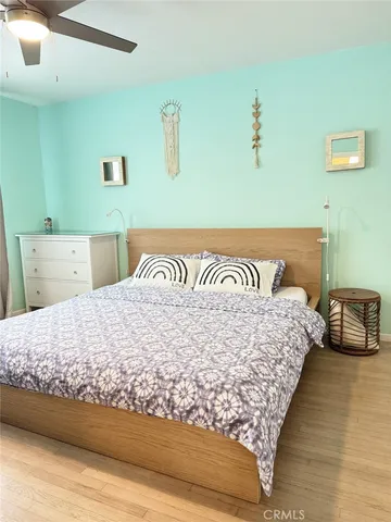 a bedroom with a bed and a table