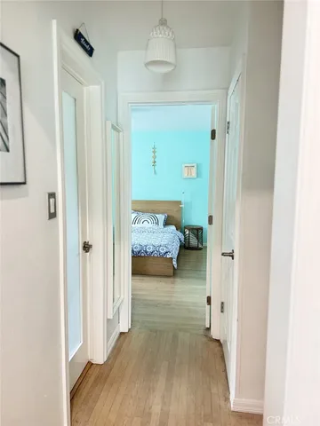 a yellow house with tree in front of it