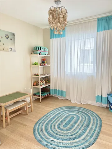 a view of a livingroom with furniture and staircase