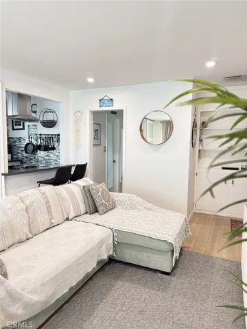 a bedroom with a bed and couch