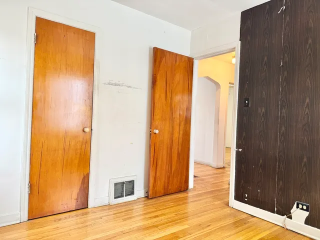 a view of a bathroom with a shower and a door