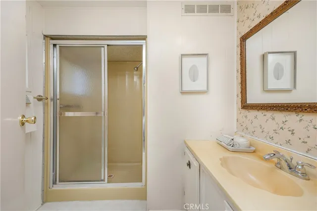 a bathroom with a sink and mirror