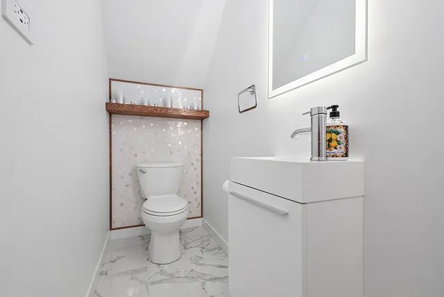 a bathroom with a toilet and a sink