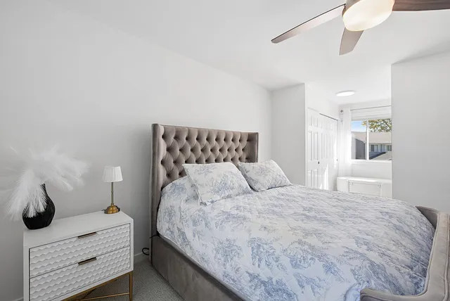 a bedroom with a bed and a cabinets