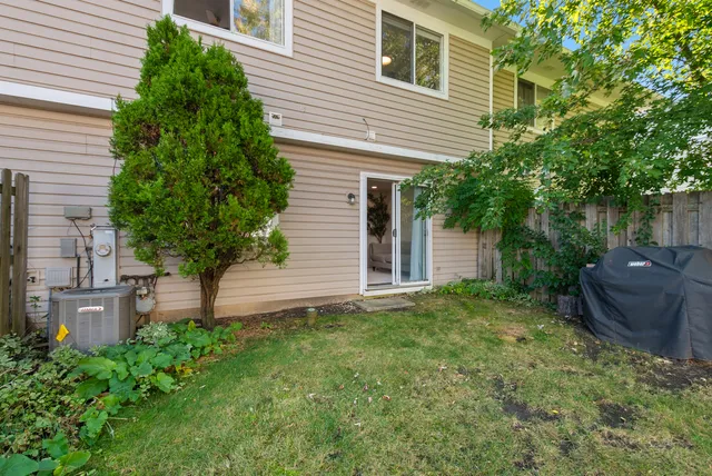 a view of a house with a backyard