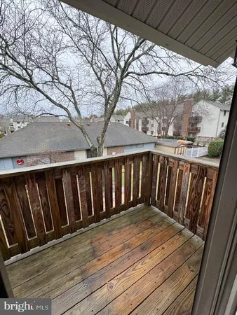 a view of outdoor space with deck and hardwood