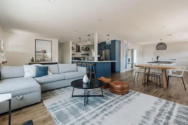 a bathroom with double vanity sinks and a mirror