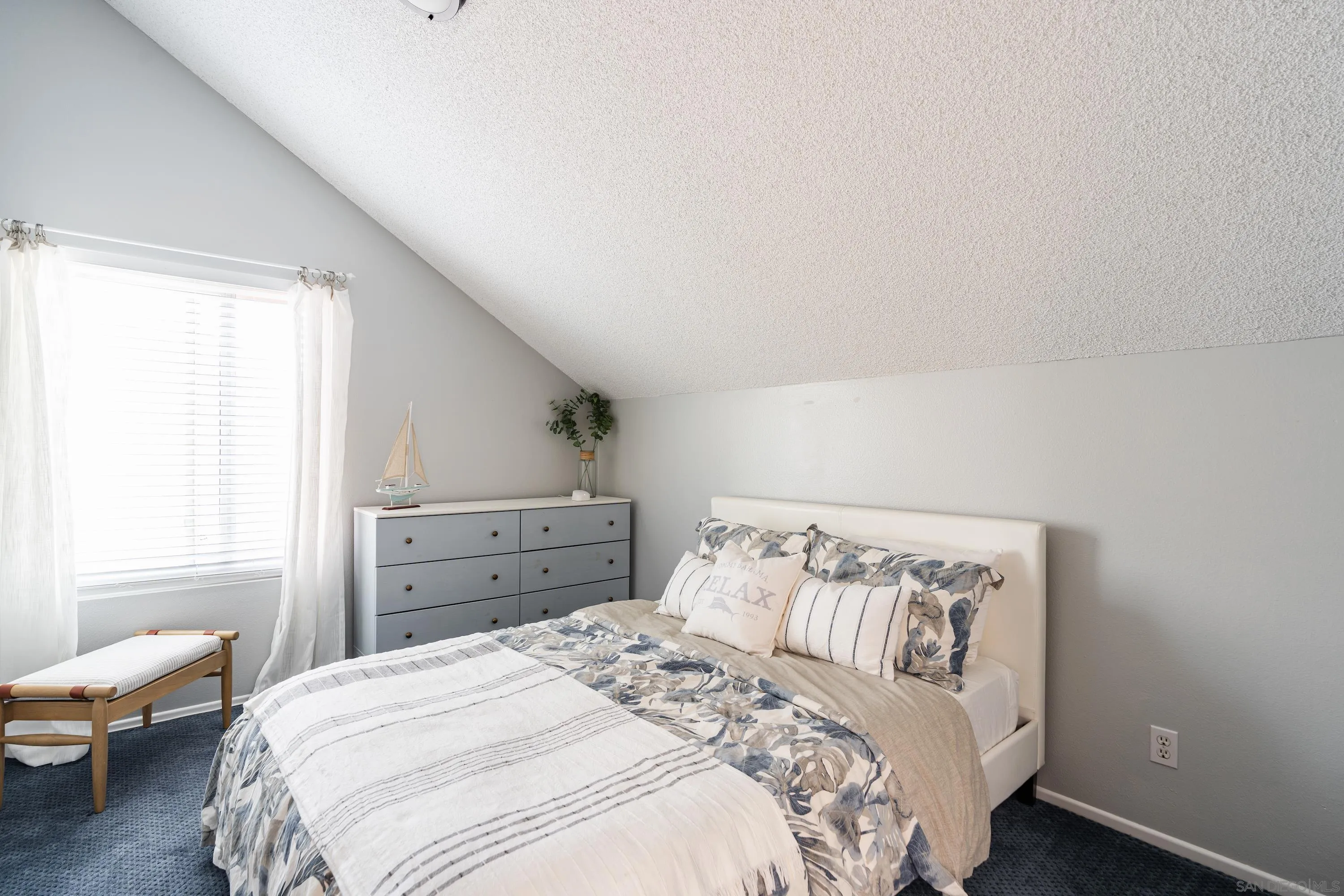 4166 Kimberly Lane Oceanside, CA 92056 - Photo 19 of 25 a bedroom with a bed and wooden floor