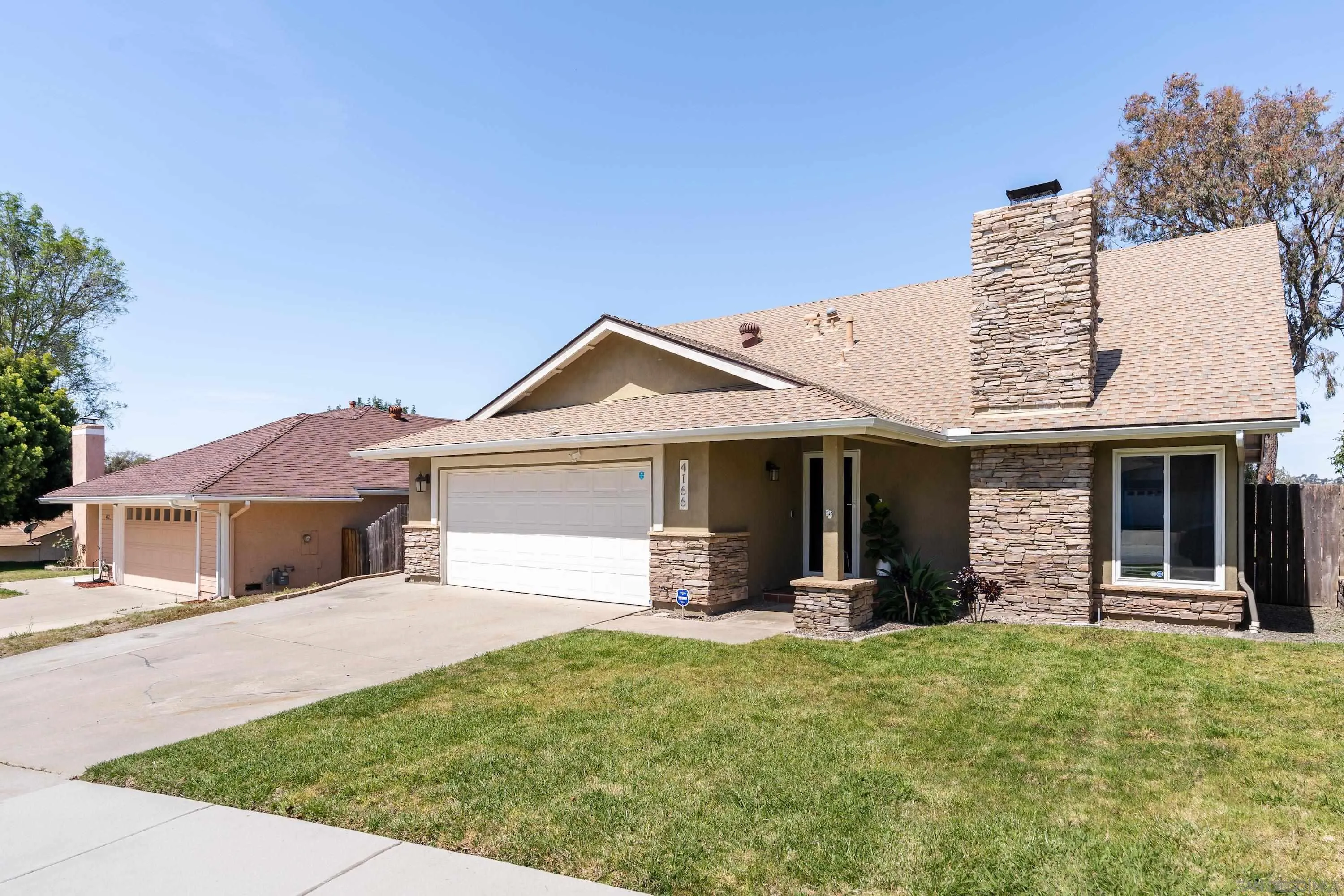 4166 Kimberly Lane Oceanside, CA 92056 - Photo 3 of 25 a front view of a house with a yard