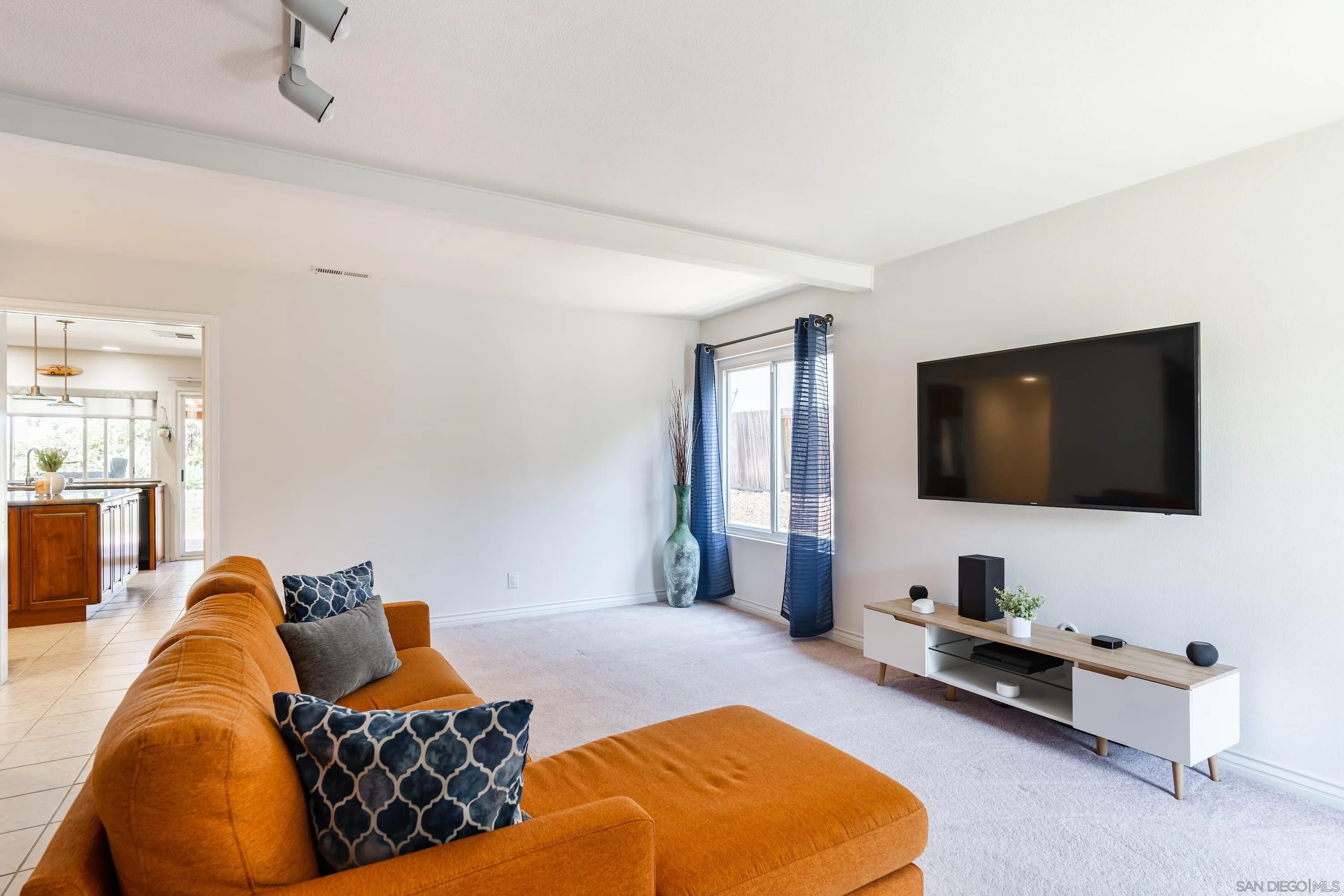 4166 Kimberly Lane Oceanside, CA 92056 - Photo 4 of 25 a living room with furniture and a flat screen tv
