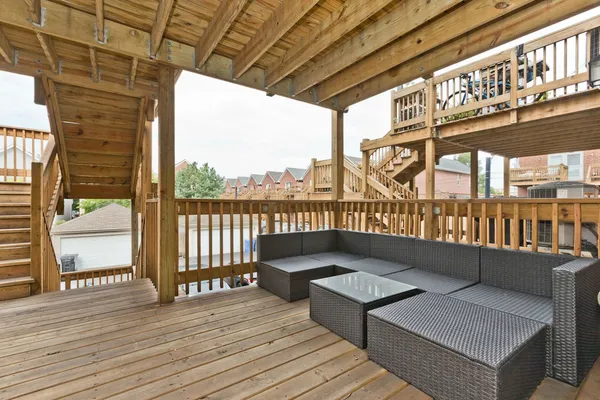 a view of balcony with furniture