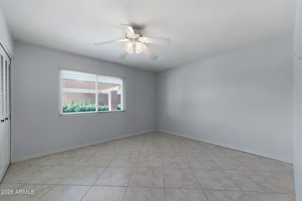 a living room with lots of furniture and painting on the wall