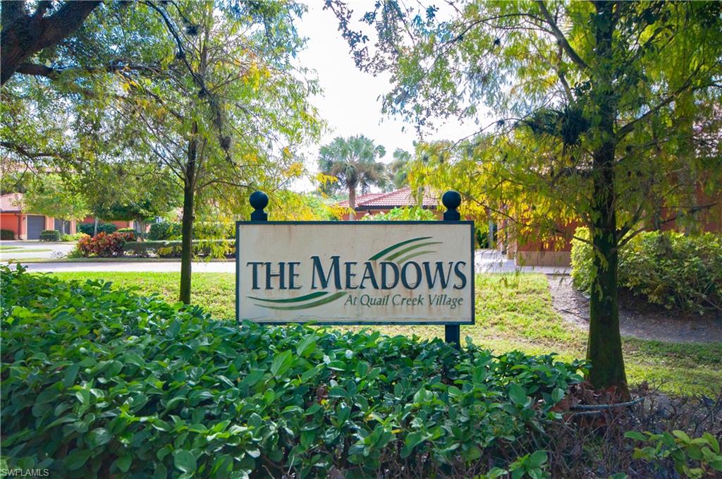 10020 Heather Lane, Unit 901 Naples, FL 34119 - Photo 31 of 34 a sign broad in front of a road