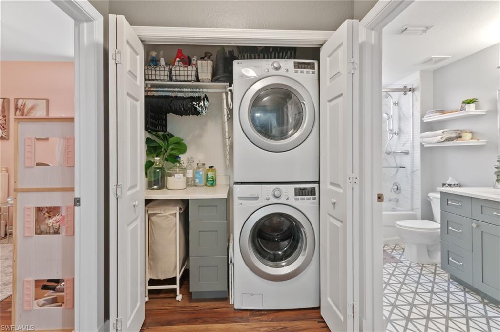 10020 Heather Lane, Unit 901 Naples, FL 34119 - Photo 32 of 34 a view of a hallway with washer and dryer